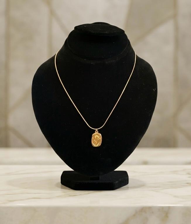 Elegant Gold Pendant on Velvet Display