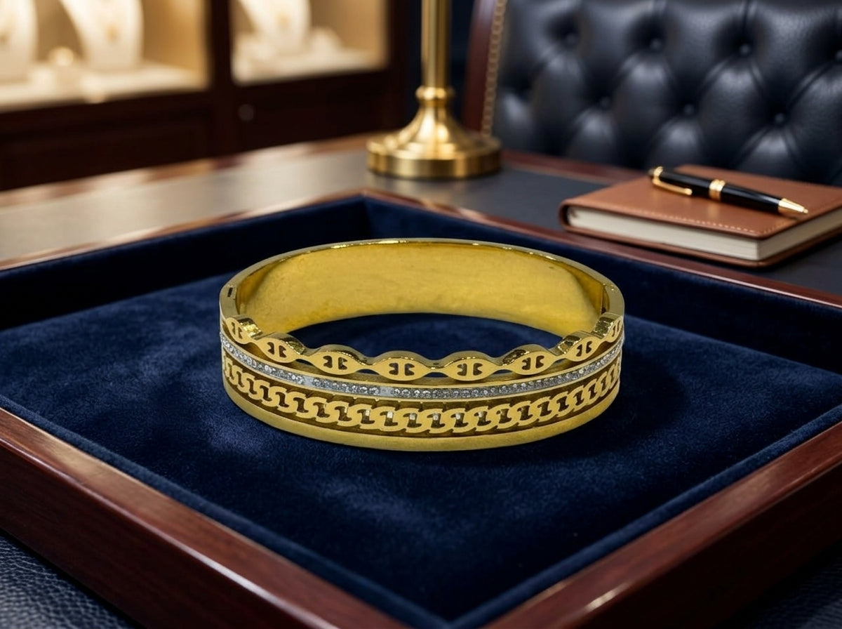 Elegant Gold-Tone Multi-Texture Bangle with Crystal Accent