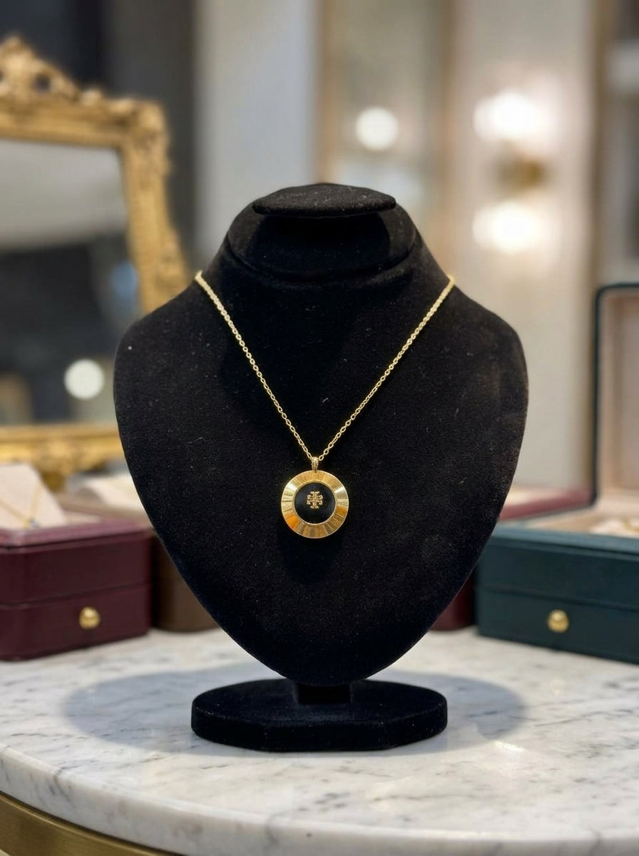 Elegant Gold-Tone Round Pendant Necklace with Black Center Design