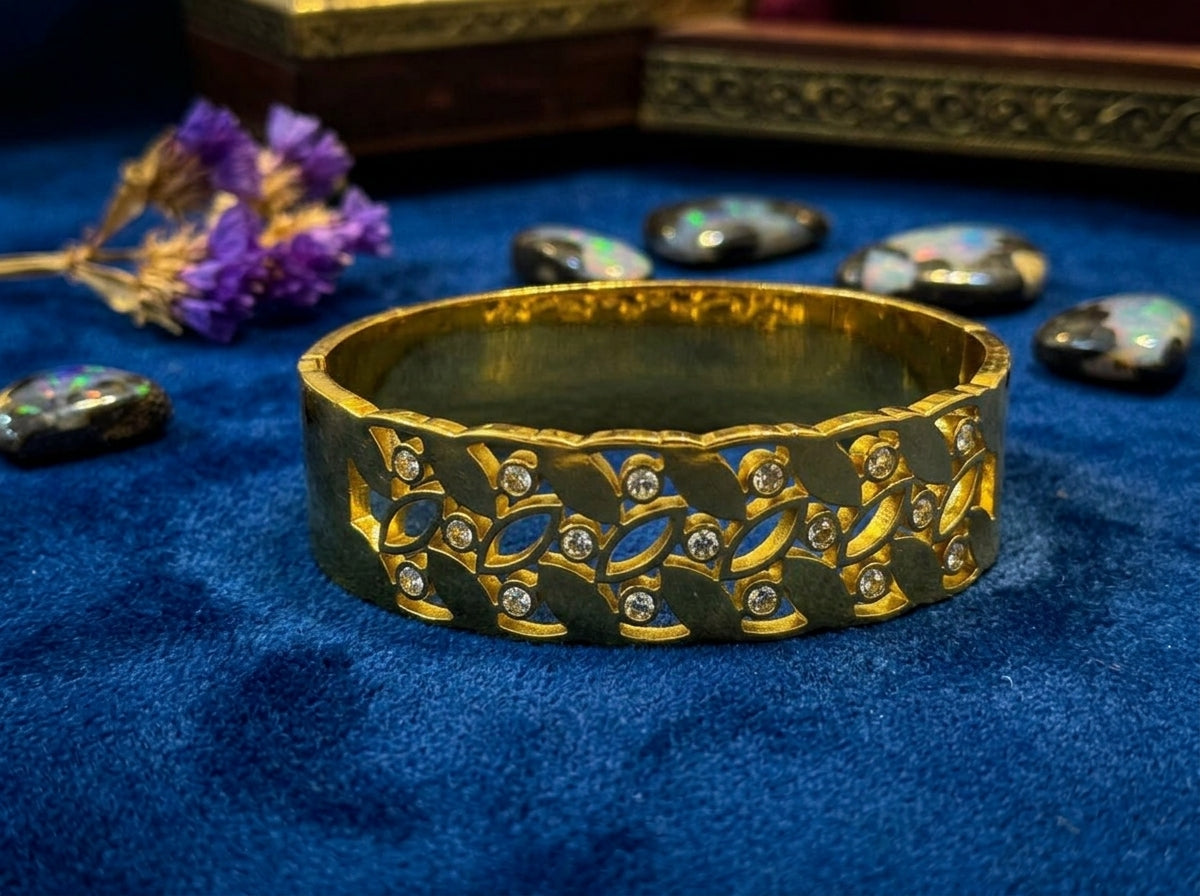 Elegant Gold Leaf Motif Bangle with Stone Accents