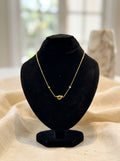 Elegant Gold-Tone Knot Necklace with Delicate Stone Accents
