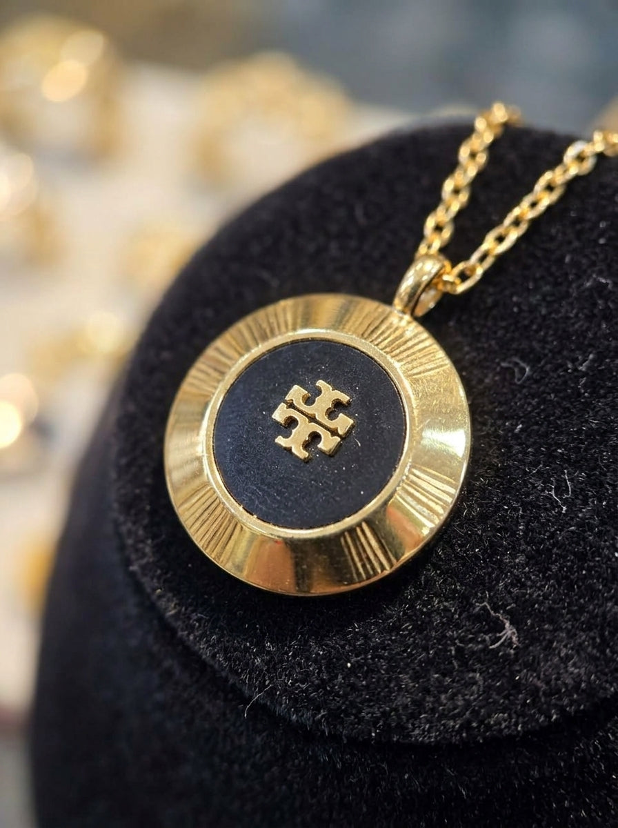 Elegant Gold-Tone Round Pendant Necklace with Black Center Design