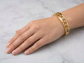 Elegant Gold-Tone Floral Cutout Bangle with Sparkle Accents