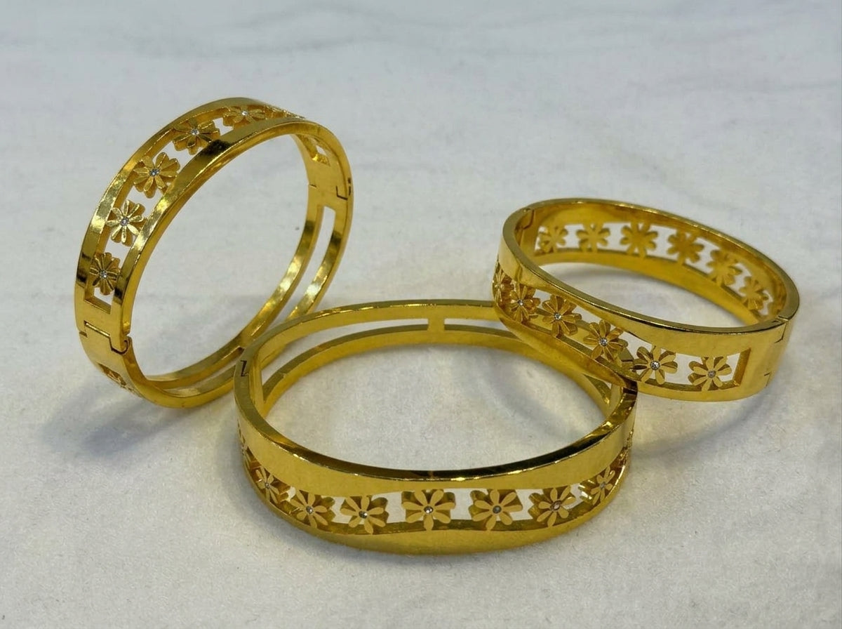 Elegant Gold-Tone Floral Cutout Bangle with Sparkle Accents