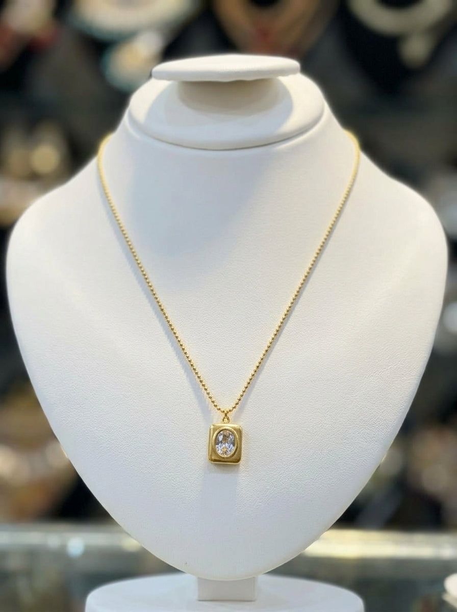 Elegant Gold-Tone Rectangular Pendant Necklace with Crystal Stone